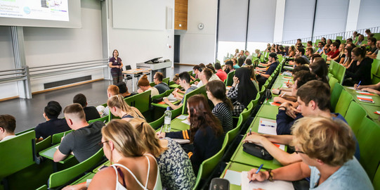 Students sit in a lecture at the beginning of the study.